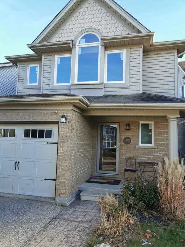 Full Front Window Transformation: after The same Barrie home with new front windows, including the arched window, after replacement