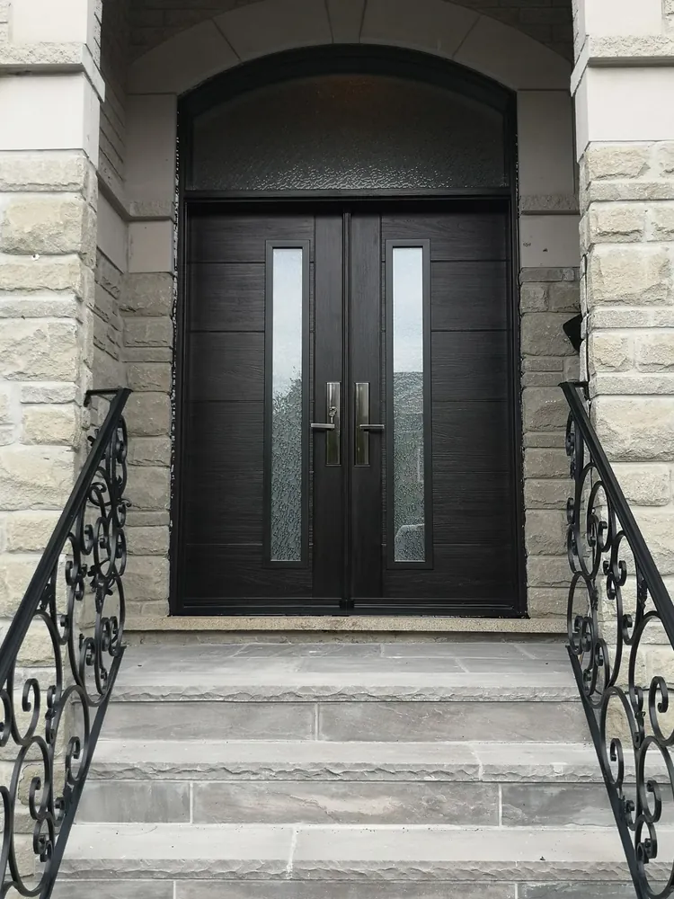 Black double doors with an arched transom, installed by Panorama Windows & Doors Black double doors with an arched transom
