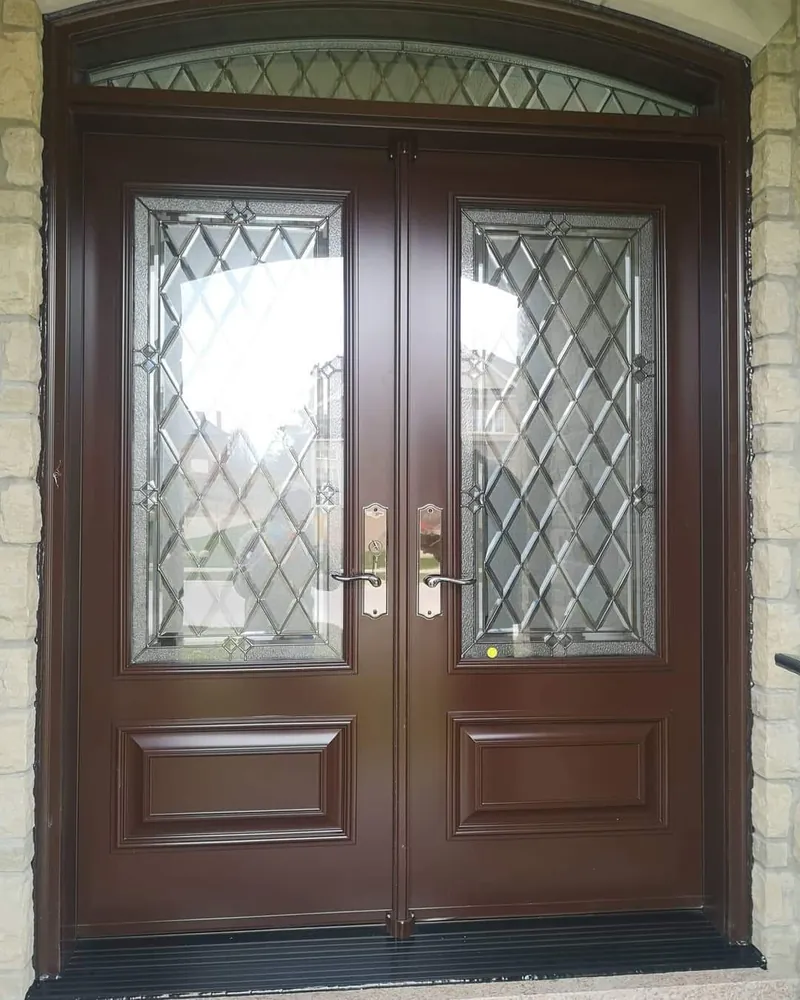 Brown double entry doors with an arched transom, installed by Panorama Windows & Doors Brown double entry doors with an arched transom