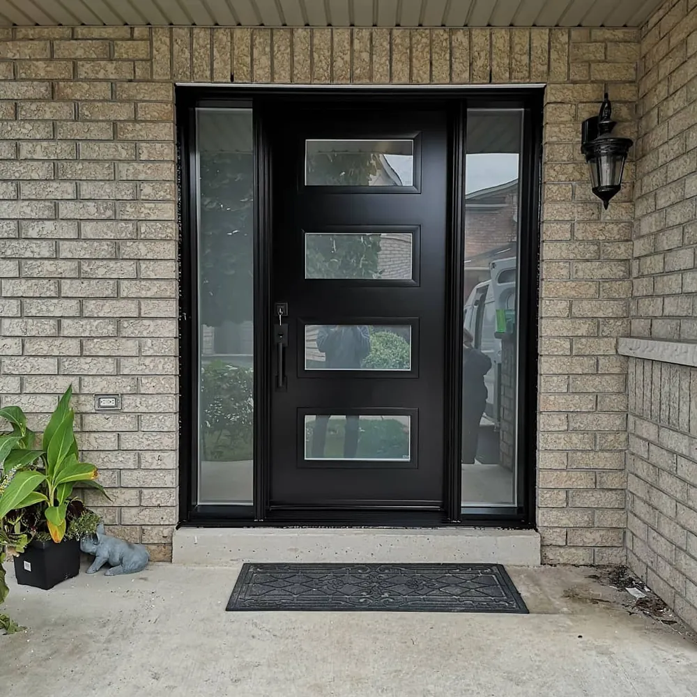 Black modern four-lite door with sidelights in Hamilton, installed by Panorama Windows & Doors Black modern four-lite door with sidelights in Hamilton