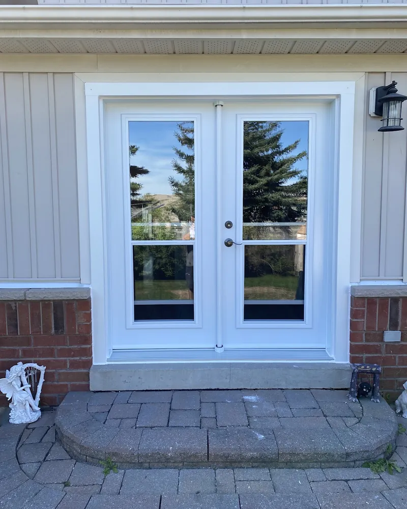 Garden Door to White French Doors: after Patio doors on a siding wall after replacement