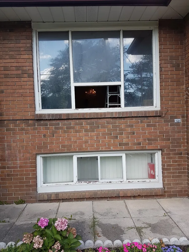 Picture window and basement window on red brick in Hamilton, installed by Panorama Windows & Doors Picture window and basement window on red brick in Hamilton